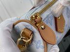 Louis Vuitton bag zipper pull and gold rings on light blue monogram canvas