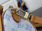 Louis Vuitton bag strap clasp with gold hardware on light blue monogram canvas