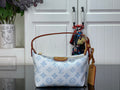 Light blue monogram canvas shoulder bag with tan leather trim and top handles