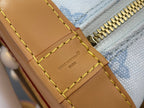 Leather strap panel with engraved logo and yellow stitching beside gold zipper