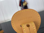 Louis Vuitton leather tag detail reading “made in France” on bag strap