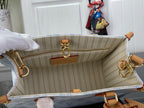 Louis Vuitton beige striped interior pouch with gold rings and tan leather trim