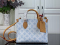 Louis Vuitton blue monogram tote bag with tan leather handles and side strap