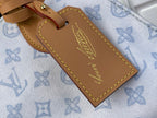 Louis Vuitton tan leather name tag on blue monogram tote with gold edge stitching