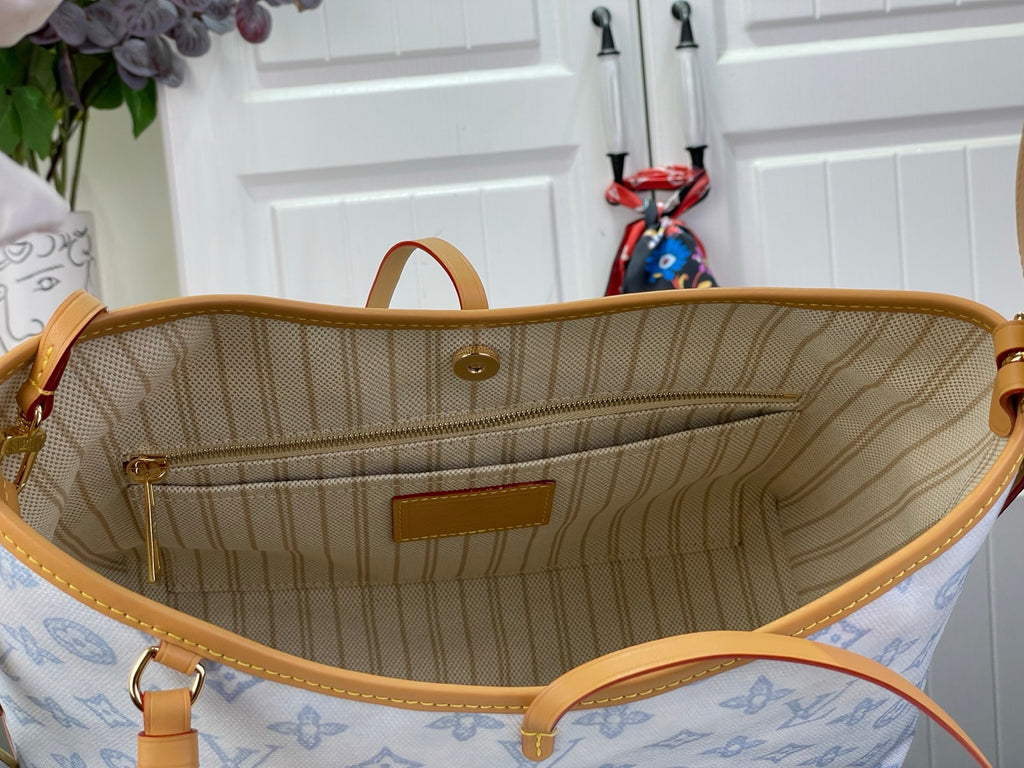 Open hobo bag showing tan striped lining and front pocket inside