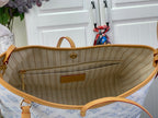 Open hobo bag showing tan striped lining and front pocket inside