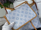 Louis Vuitton blue monogram bag with tan trim and leather strap