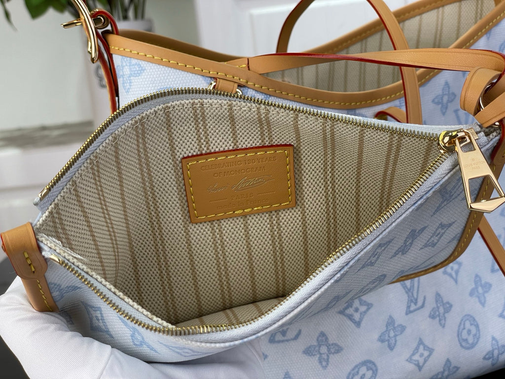 Louis Vuitton bag interior with beige lining, zipper, and tan leather label