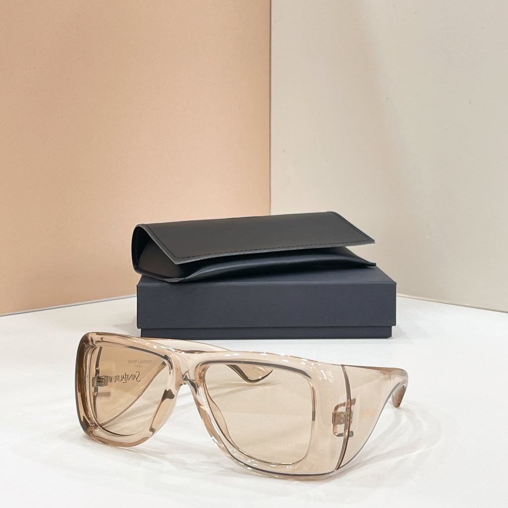 Sunglasses with clear lenses and translucent amber frames, with dark case behind