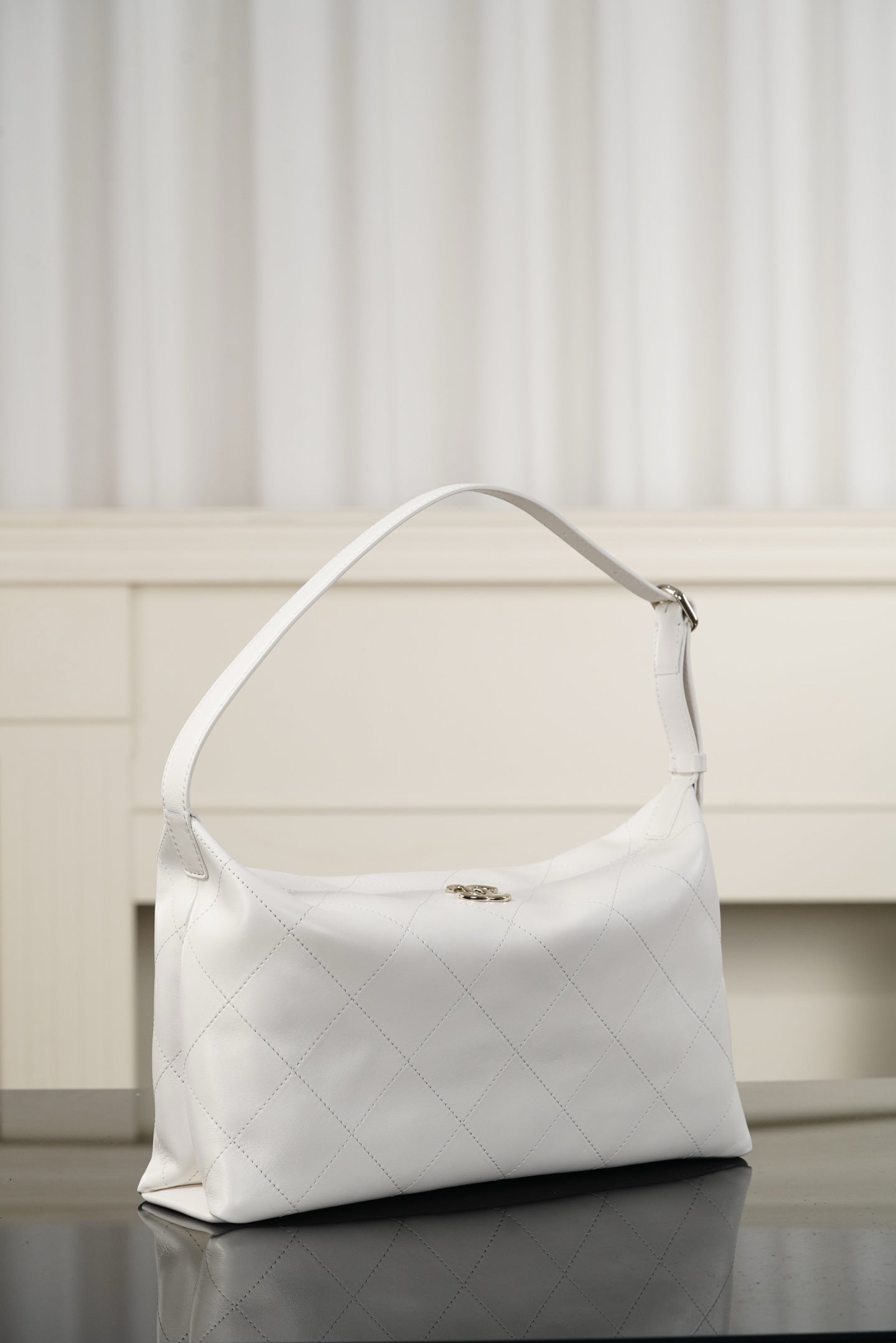 Chanel white quilted hobo shoulder bag with top handle, curved shoulder strap