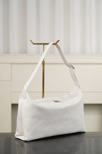 Chanel white quilted shoulder bag with short handles and side profile with hardware