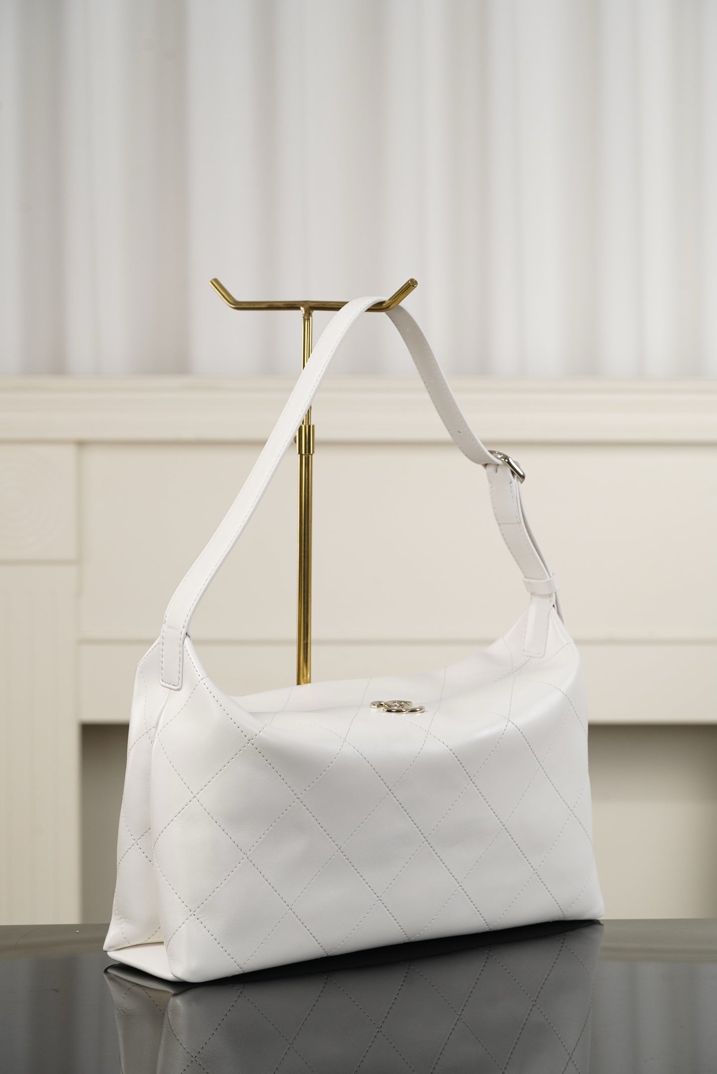 Chanel white quilted shoulder bag with short handles and side profile with hardware