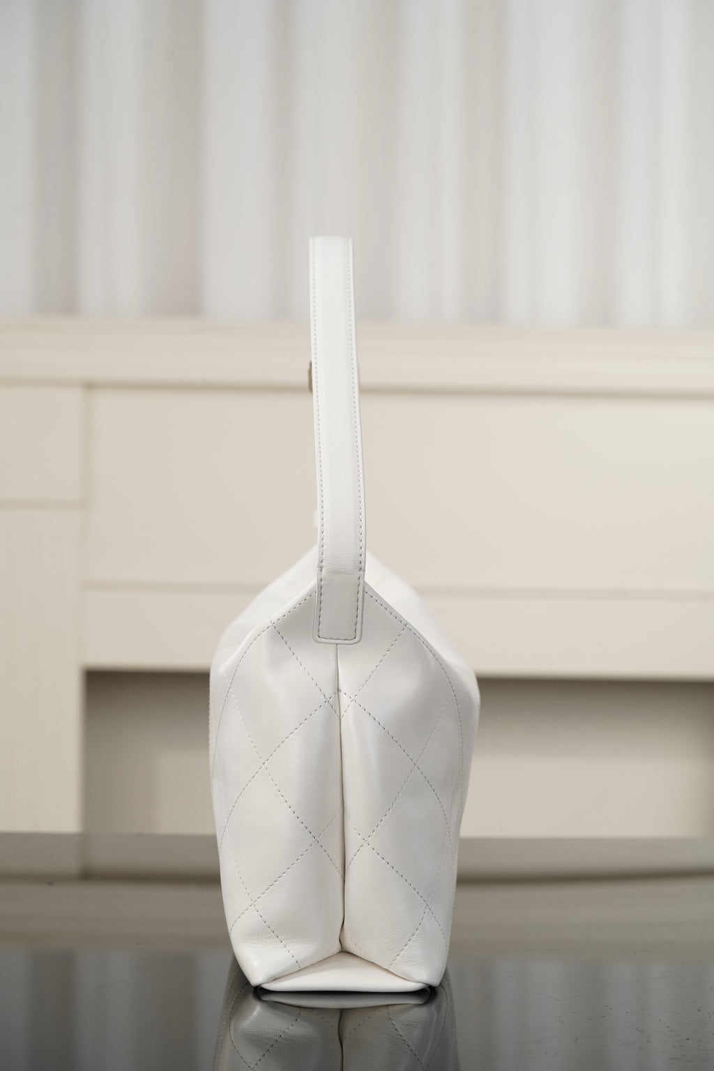 Chanel white quilted bag with vertical seam and top loop handle