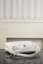 Chanel white quilted shoulder bag with flap and gold CC logo on top