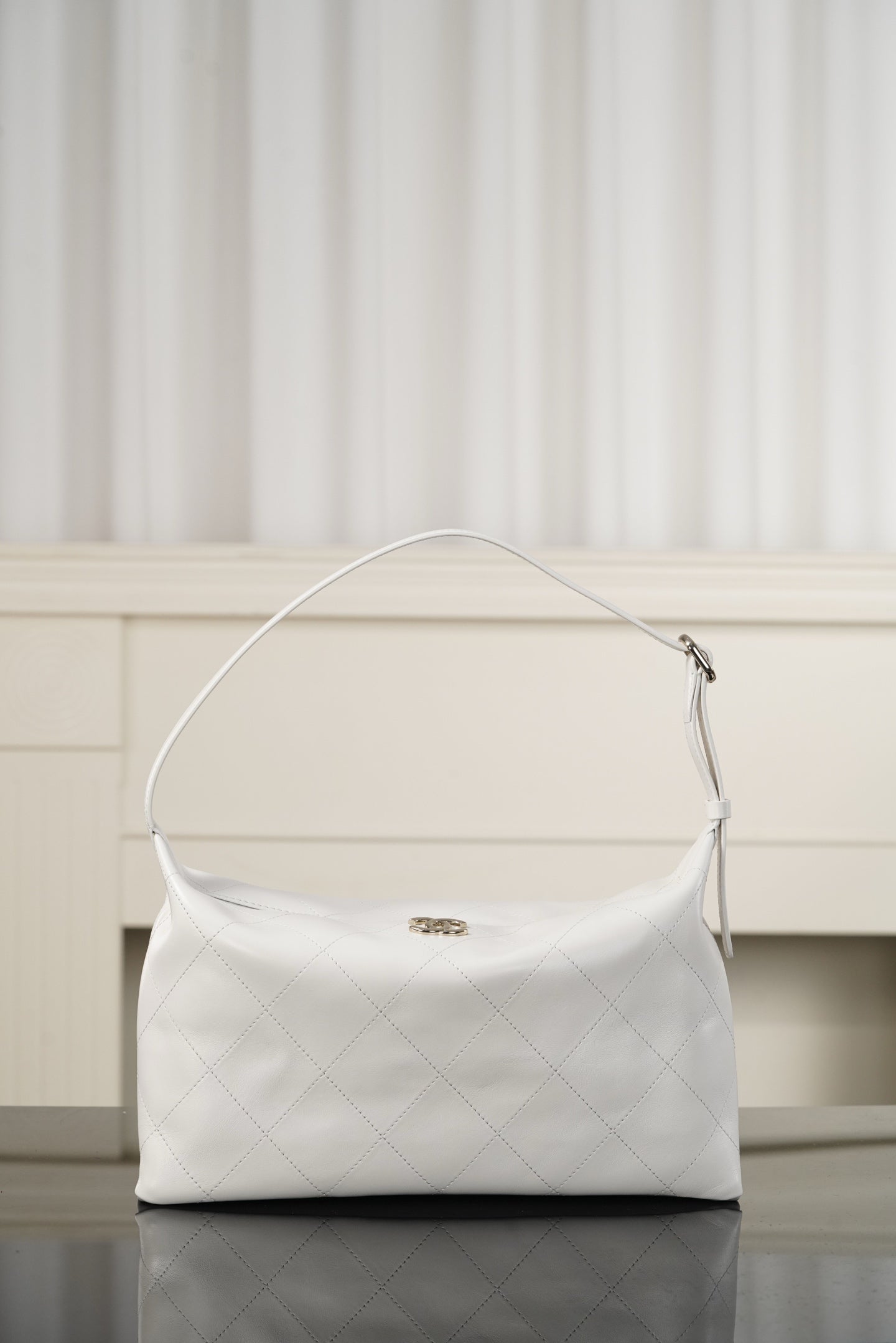 Chanel white quilted hobo shoulder bag with wide top opening and shoulder strap