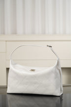 Chanel white quilted hobo shoulder bag with curved top handle and dangling strap tab