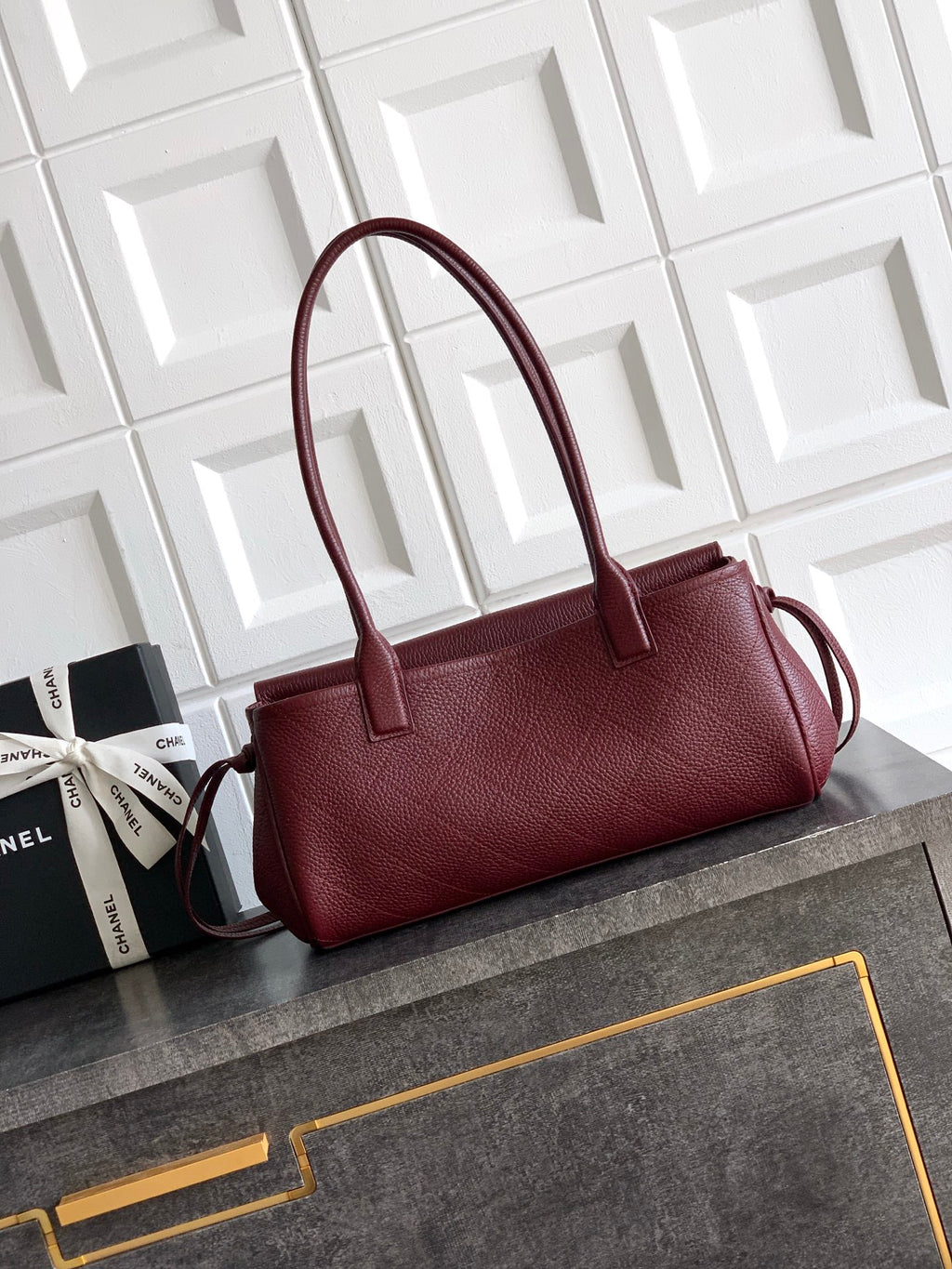 Chanel burgundy textured leather handbag with structured top and side strap loop