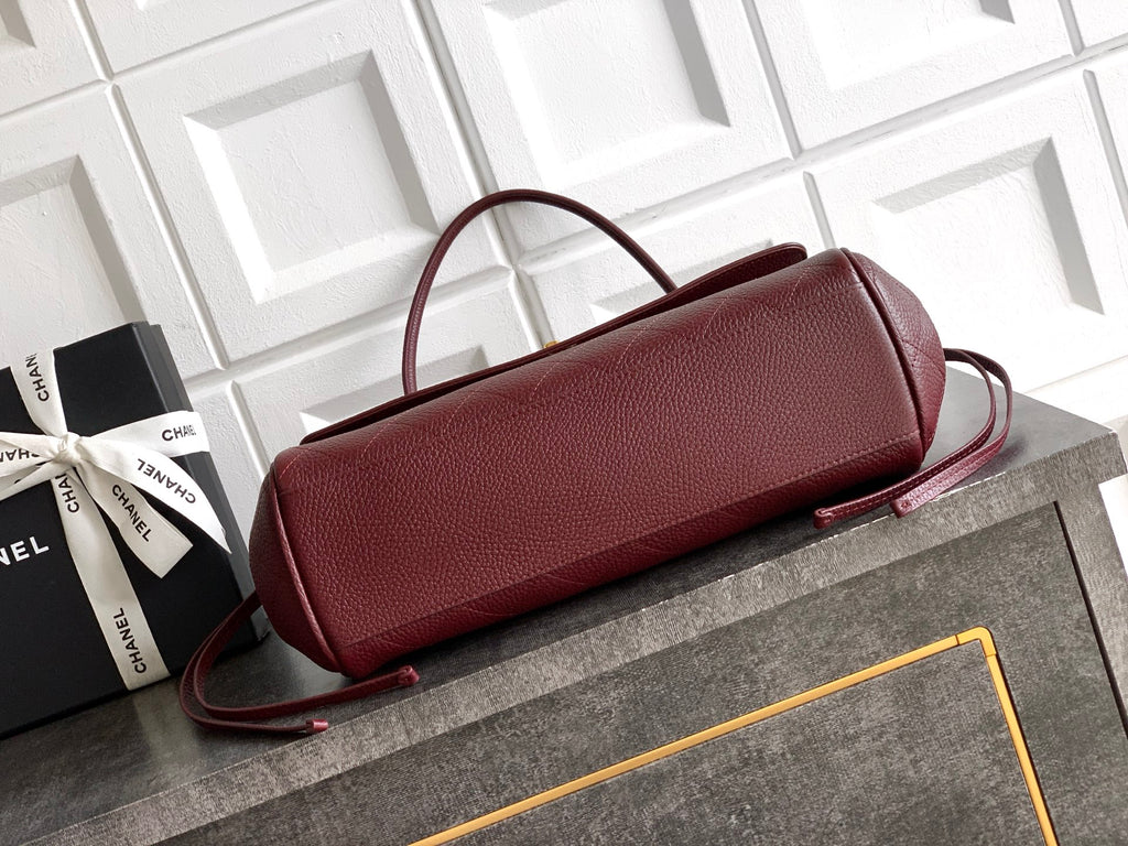 Chanel burgundy top-handle handbag with detachable crossbody strap and gold logo hardware