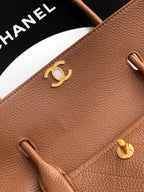Chanel brown leather flap with gold CC logo and side loop details