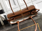Chanel brown leather handbag with double zip opening and attached side strap