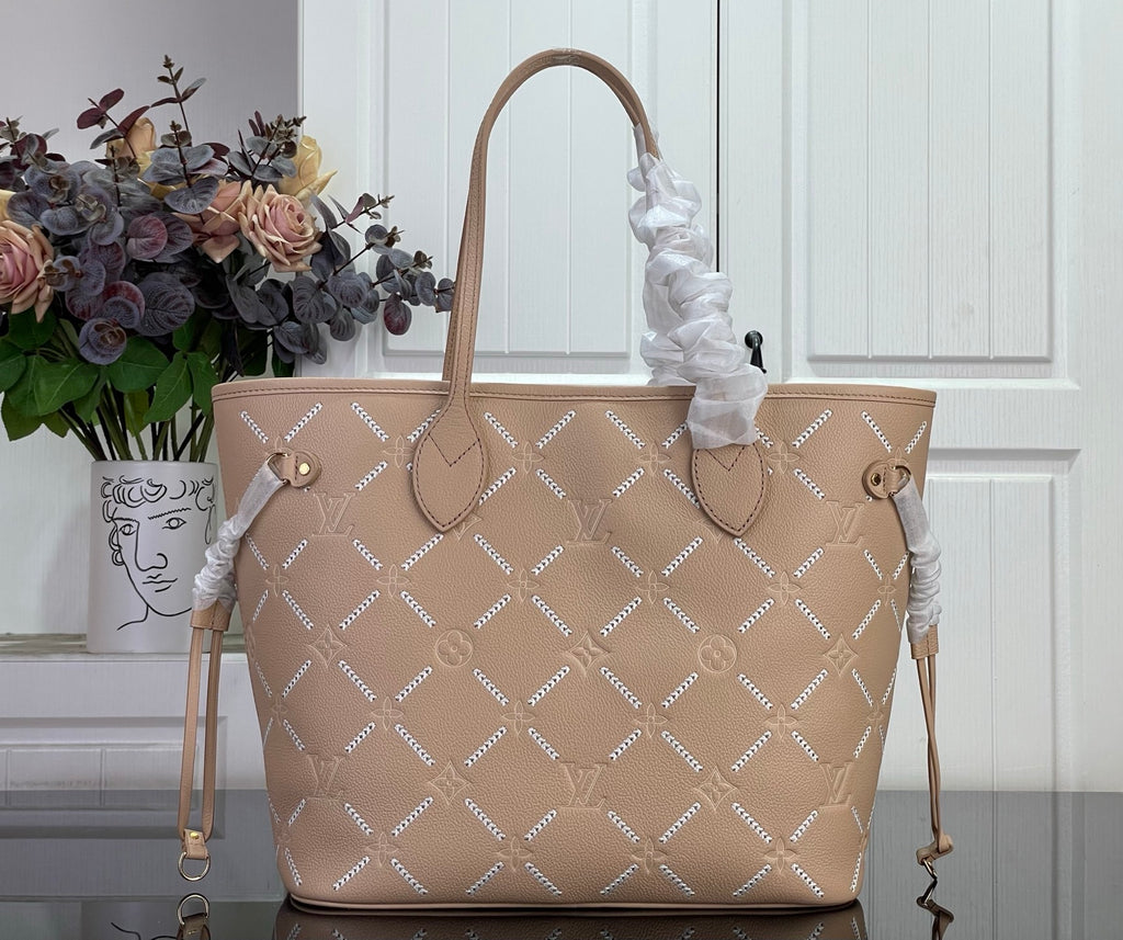 Louis Vuitton taupe monogram tote bag with top handles and braided side tassels