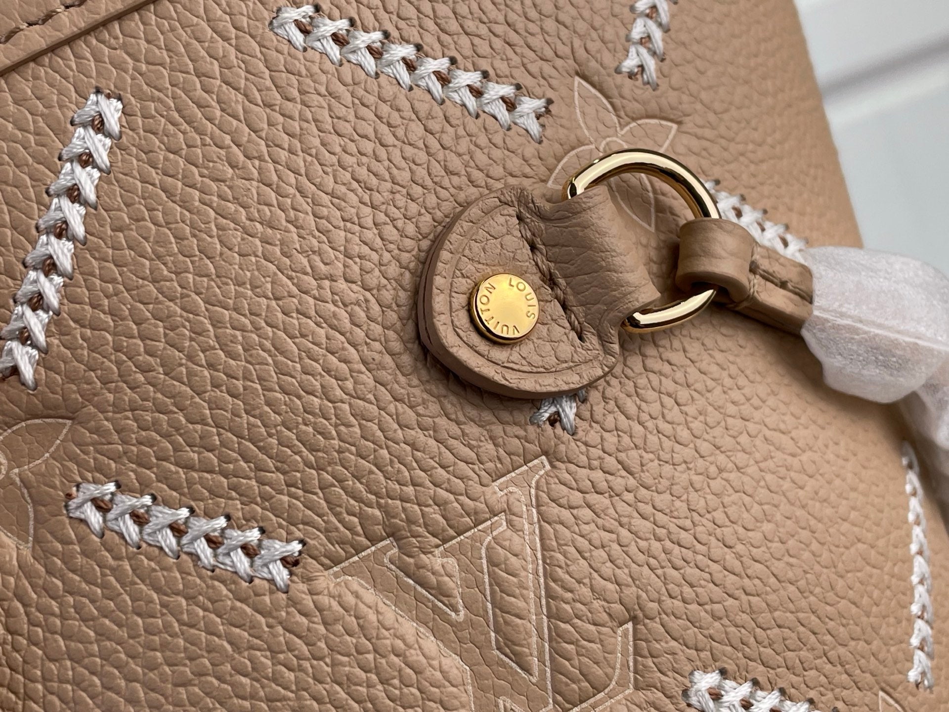 Louis Vuitton taupe leather charm and braided trim on textured monogram panel