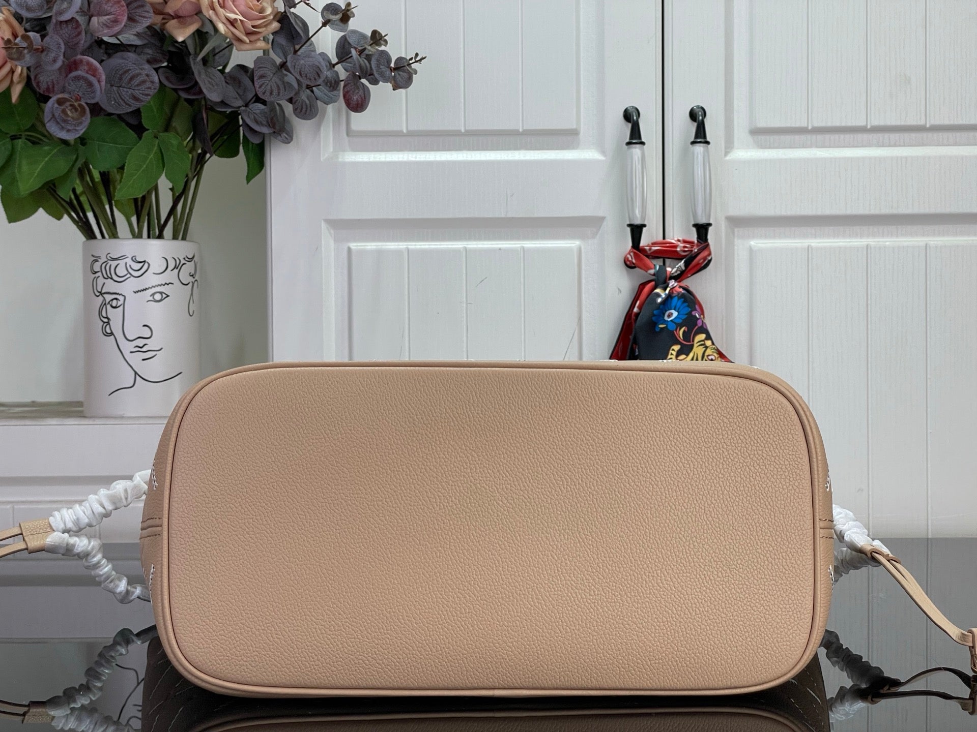 Louis Vuitton taupe pebbled leather bag with rounded top and gold-tone hardware