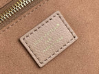 Louis Vuitton taupe leather card holder with engraved “Louis Vuitton” text