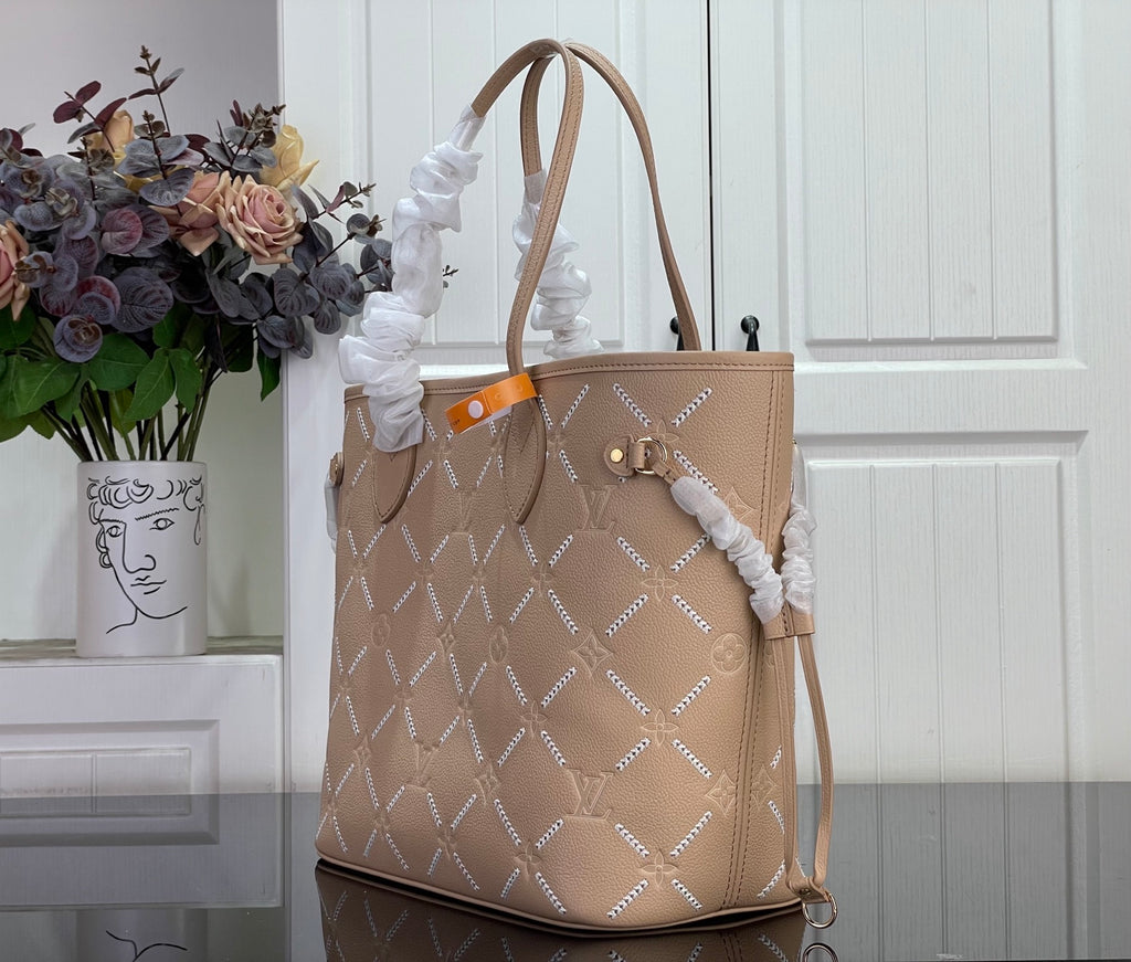 Louis Vuitton taupe monogram tote bag with side bow detail and long shoulder straps