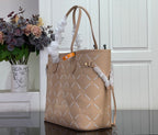 Louis Vuitton taupe monogram tote bag with side bow detail and long shoulder straps