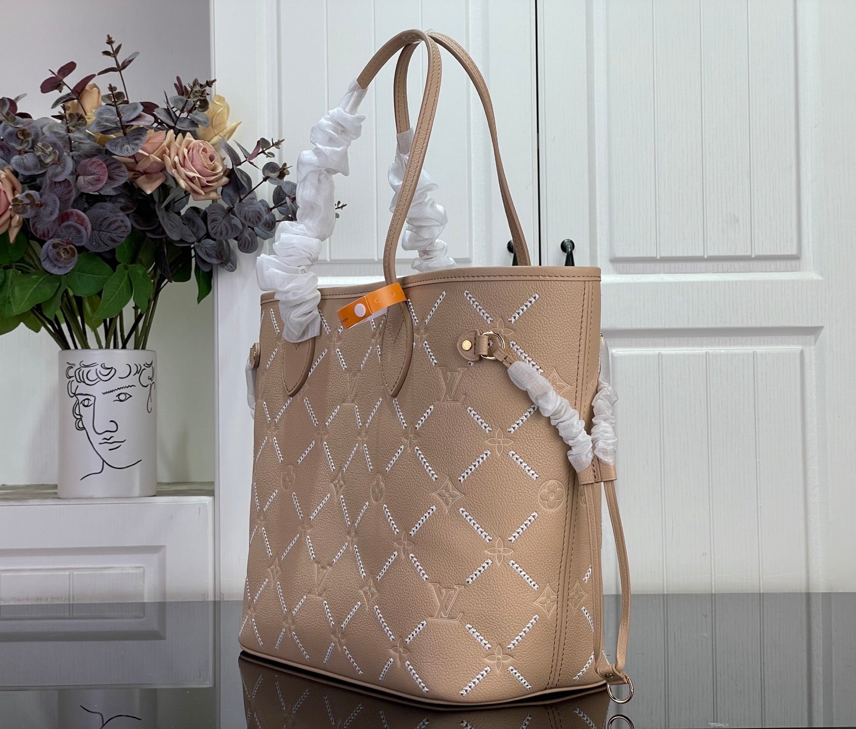 Louis Vuitton taupe monogram tote bag with side bow detail and long shoulder straps