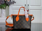 Louis Vuitton monogram handbag with orange top handles and side straps, front view