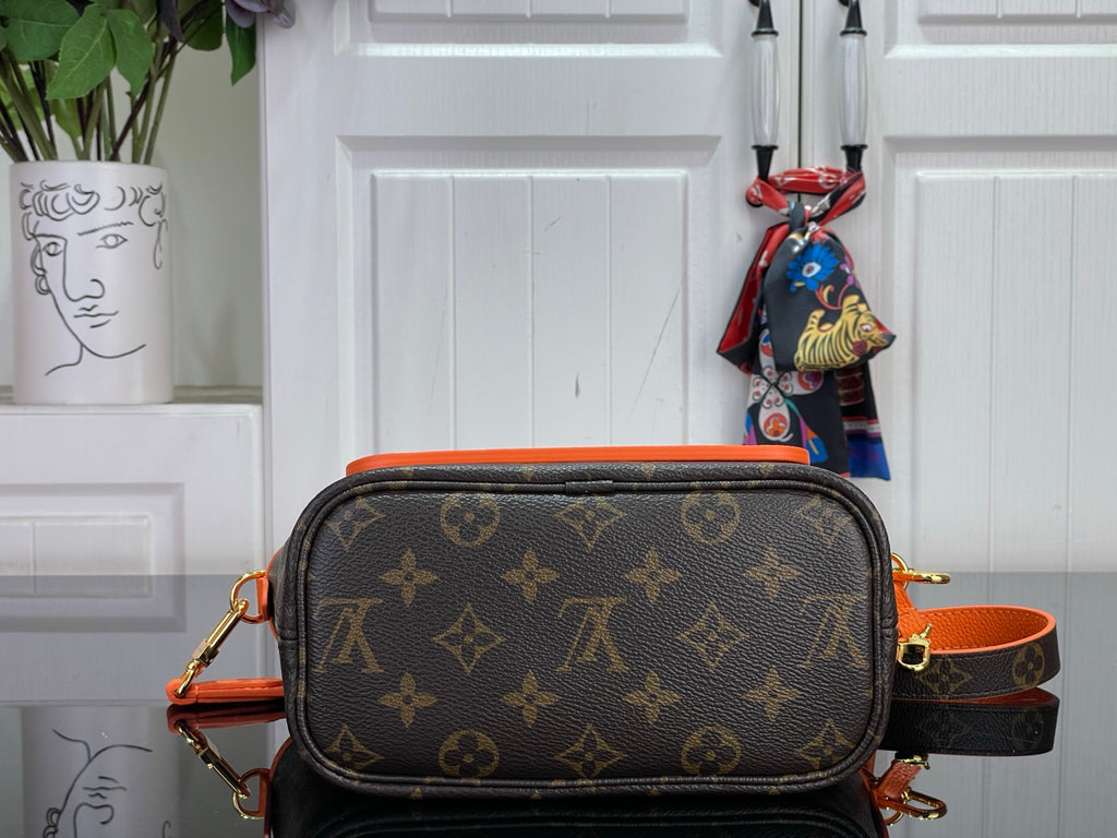 Louis Vuitton monogram crossbody bag with oval flap and orange trim, front view