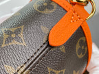 Louis Vuitton monogram canvas with textured leather trim and orange strap edge