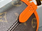 Louis Vuitton monogram bag corner with orange leather strap and close-up stitching