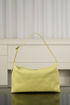 Chanel hobo bag in light yellow leather with curved shoulder strap and diamond-quilted front