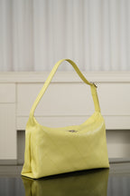 Chanel hobo bag in light yellow leather with curved handle and diamond quilting detail