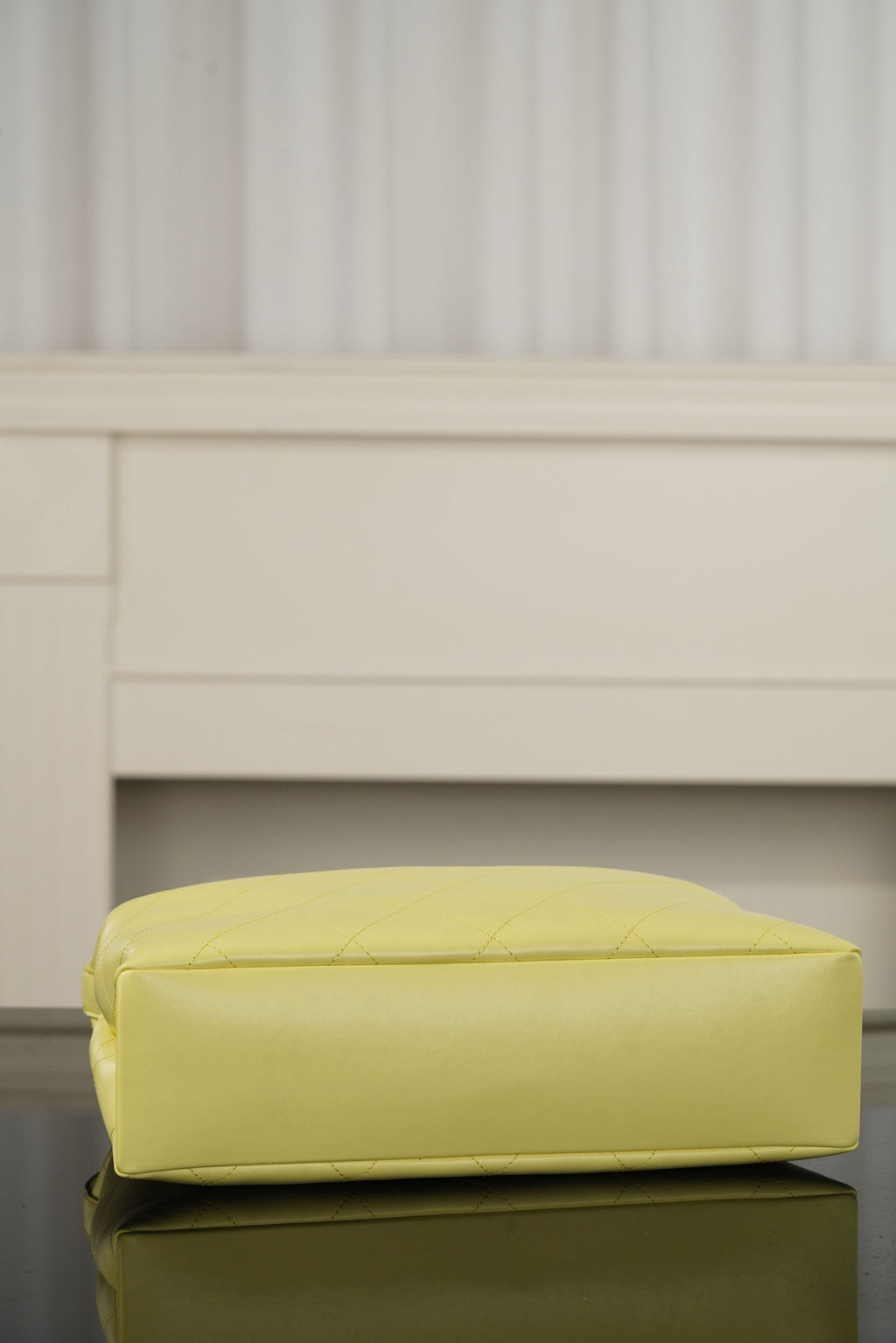 Chanel bag base in light yellow leather with diamond quilting, rounded bottom and stitching