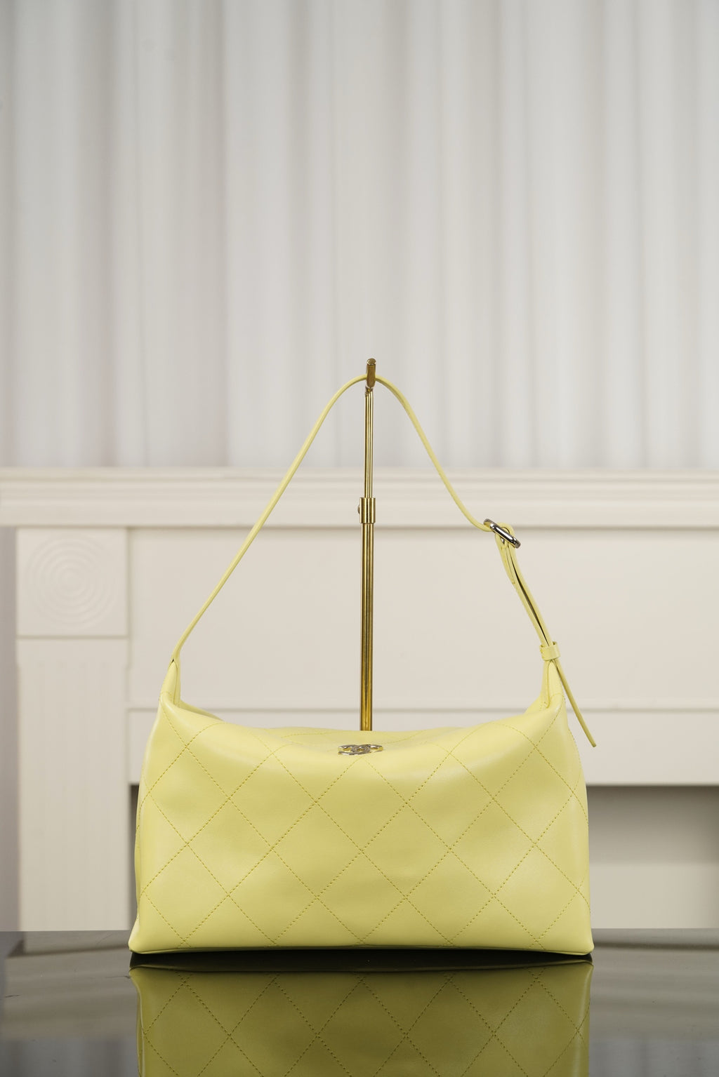 Chanel hobo bag in light yellow leather with diamond-quilted pattern and gold-tone hardware