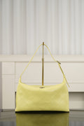 Chanel hobo bag in light yellow leather with diamond-quilted pattern and gold-tone hardware