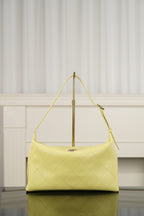 Chanel hobo bag in light yellow leather with diamond-quilted pattern and gold-tone hardware