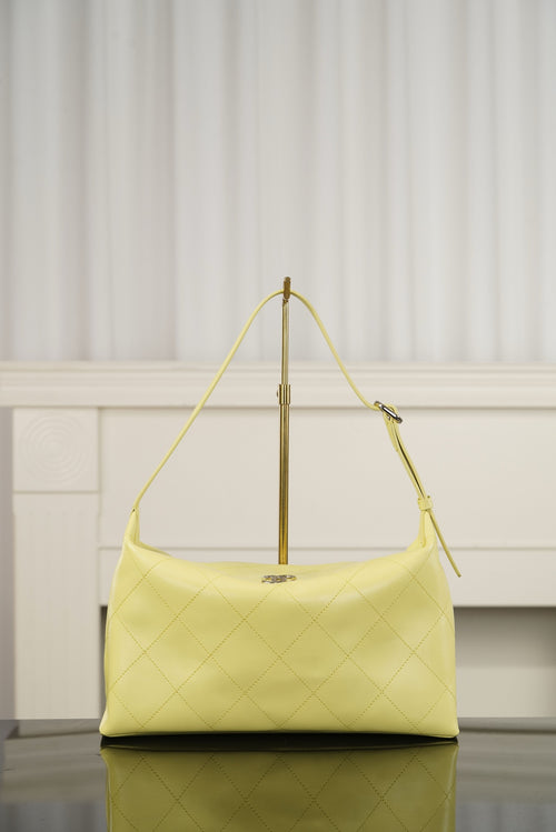 Chanel hobo bag in light yellow leather with diamond-quilted pattern and gold-tone hardware