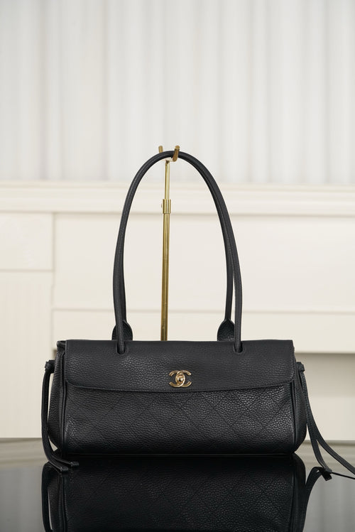 Chanel handbag in dark textured leather, top handle, flap with gold logo, crossbody strap