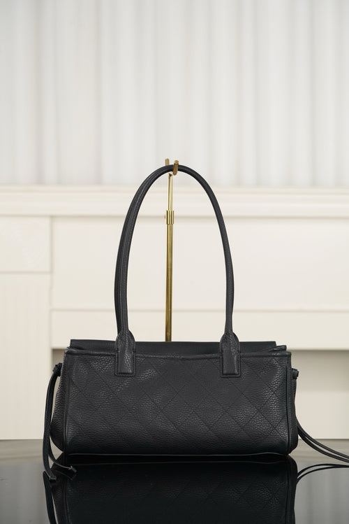 Chanel handbag with structured top, dark quilt-textured leather, gold logo clasp, handles