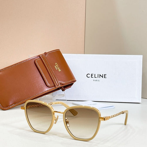 Gold-tone cat-eye sunglasses with light lenses and gold chain temples