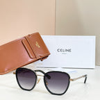 Black cat-eye sunglasses with dark lenses and gold chain temples