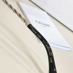 Chain temple detail with Celine Paris branding on black sunglass arm