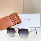 Sunglasses with round purple gradient lenses, gold-tone frame, and chain-link temple arms
