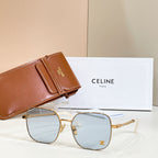 Sunglasses with round light gradient lenses, gold-tone frame, and chain-link temple arms
