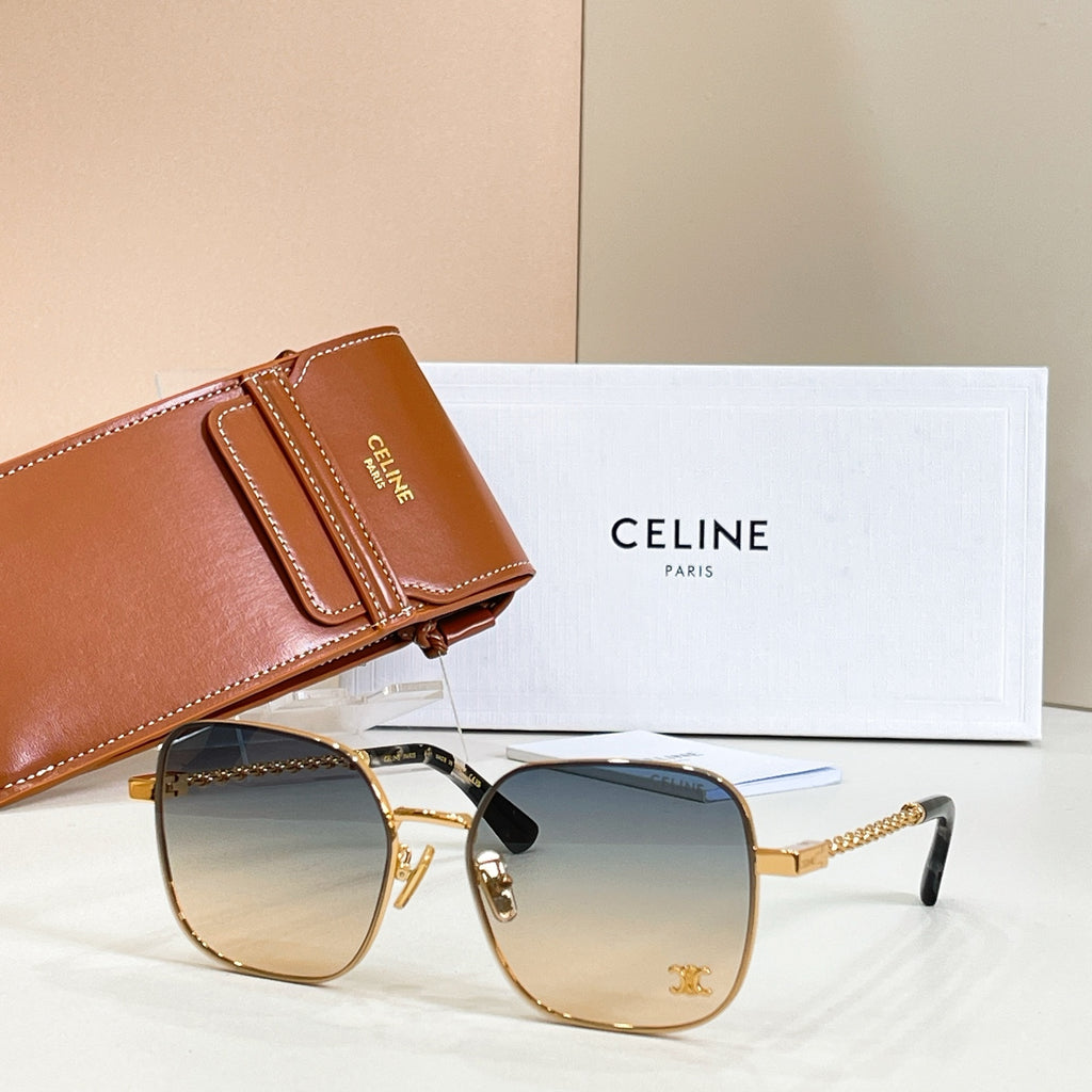 Sunglasses with round blue gradient lenses, gold-tone frame, and chain-link temple arms